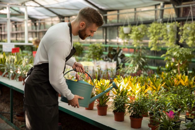 medium-shot-man-watering-plants